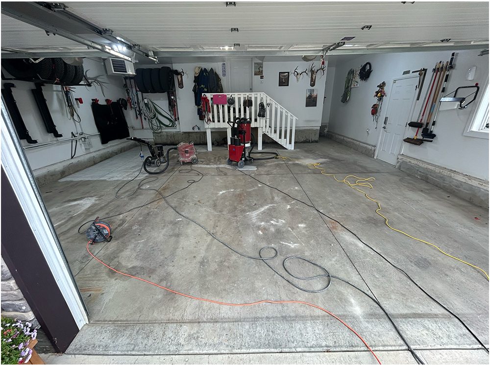 Worn and stained garage floor before coating