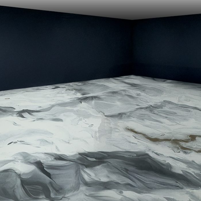 Metallic epoxy floor with marbled white and grey movement